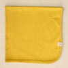 Minimalist cotton baby swaddle blanket in Prairie Harvest. Made in Canada