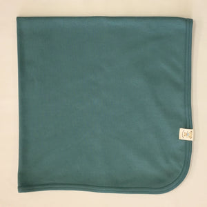 Minimalist cotton baby swaddle blanket in Spruce Forest. Made in Canada